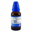Homeopathic medicine bottle labelled Mucuna-Pruriens with blue cap on a white background