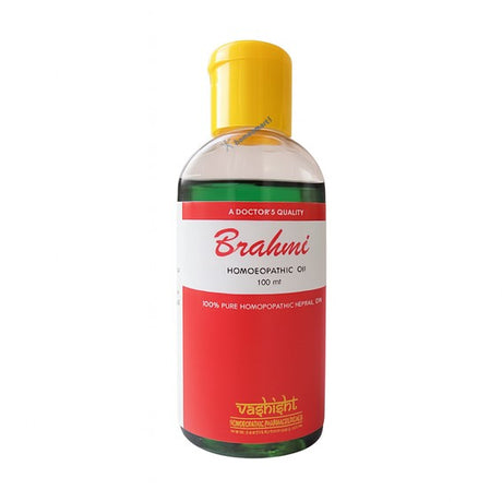 Brahmi homoeopathic oil bottle with yellow cap on a white background