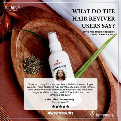Hair reviver bottle on a wooden tray with product review text and branding