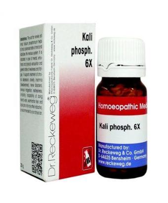 A product image showing a bottle of Reckeweg Biochemic Kali Phosphoricum 6x tablets, with the packaging box in the background. The bottle has a white and red label, and the box is primarily red and white with text and branding.
