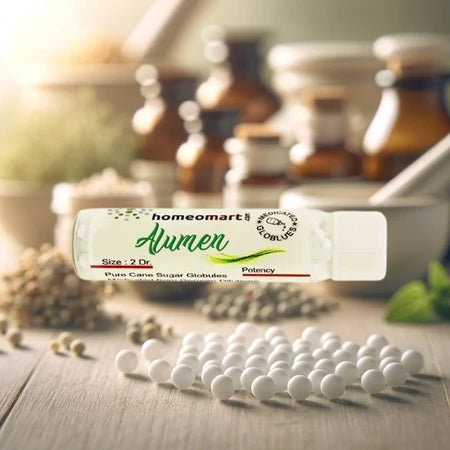 Homeopathy alumen globules with 'homeomart' label on a wooden surface