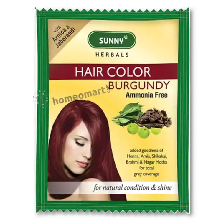 Packaging of Bakson Sunny Herbal Hair Color in Burgundy color with the brand logo and images of herbs. The packaging also highlights that it is enriched with goodness of Arnica, Henna, Shikakai for local and global coverage.