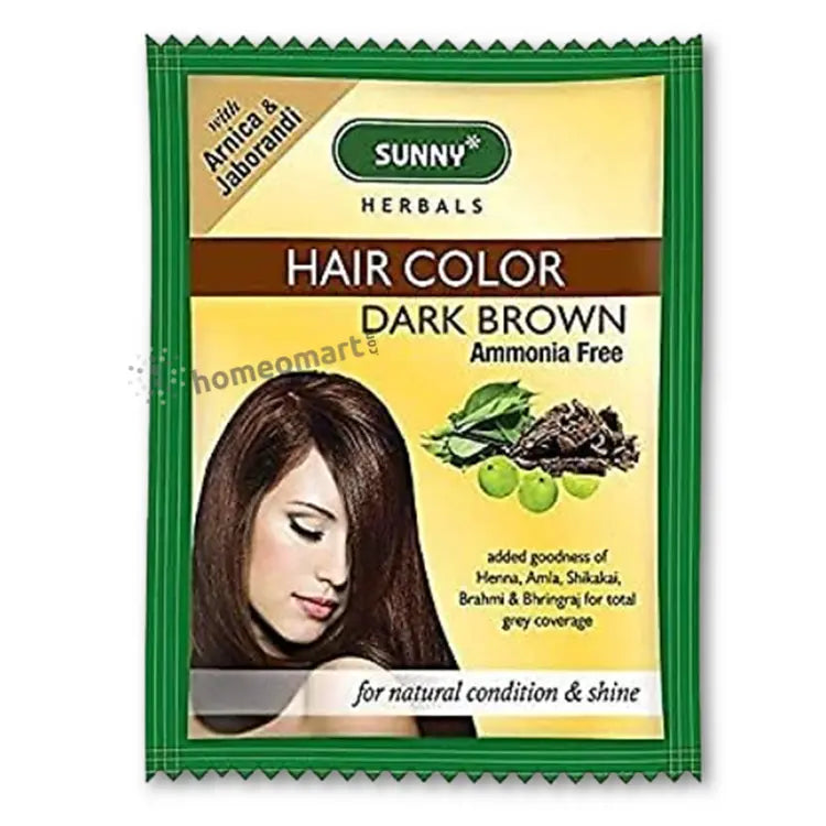 Packaging of Bakson Sunny Herbal Hair Color in dark brown color with the brand logo and images of herbs. The packaging also highlights that it is enriched with goodness of Arnica, Henna, Shikakai for local and global coverage.