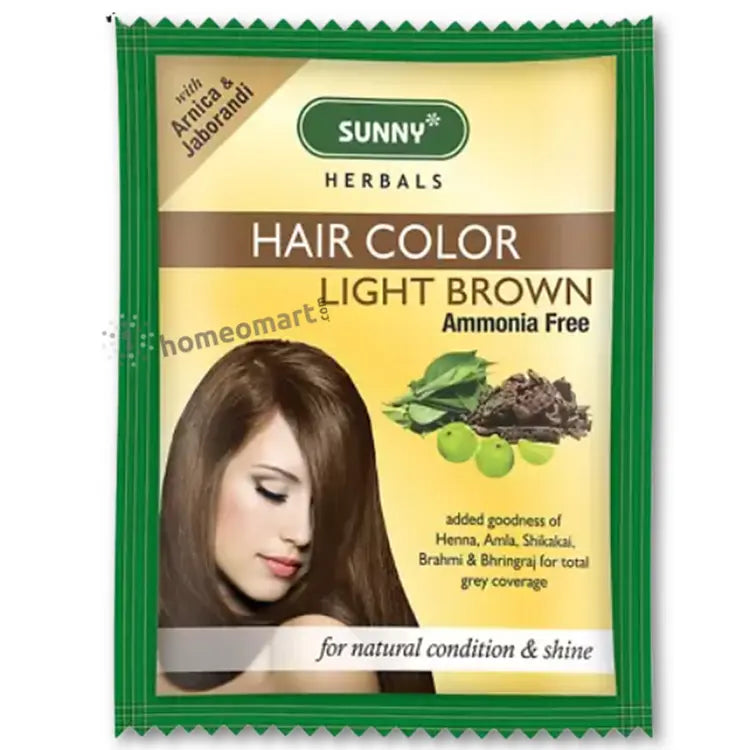 Packaging of Bakson Sunny Herbal Hair Color in light brown color with the brand logo and images of herbs. The packaging also highlights that it is enriched with goodness of Arnica, Henna, Shikakai for local and global coverage.