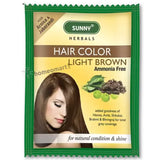Packaging of Bakson Sunny Herbal Hair Color in light brown color with the brand logo and images of herbs. The packaging also highlights that it is enriched with goodness of Arnica, Henna, Shikakai for local and global coverage.