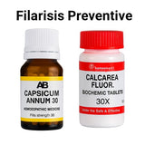 Two homeopathic medicine bottles labeled 'Capsicum Annum 30' and 'Calcarea Fluor. Biochemic Tablets 30X' on a white background.