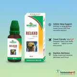 Wheezal Relaxo Drops bottle and packaging on a gradient blue and green background