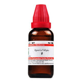 Bottle of homeopathic medicine with a red cap on a white background