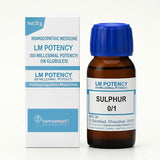 Homeopathic medicine bottle and packaging with blue and white labels on a white background