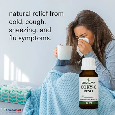 Person with a cold holding a mug, wearing a blanket, with 'Bhargaya Cory-C Drops' bottle displayed.
