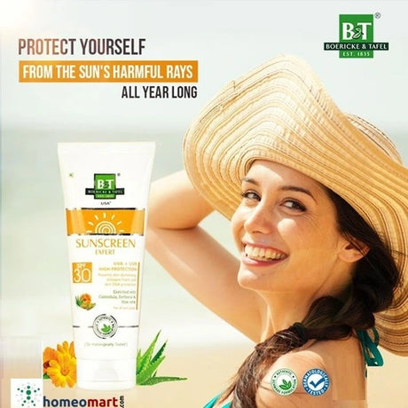 Woman wearing a sun hat with a tube of sunscreen and promotional text for Boerickie & Tafel on a light background.