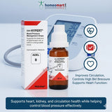 Co-Hypert blood pressure management drops with packaging and a digital blood pressure monitor on a light gray background.