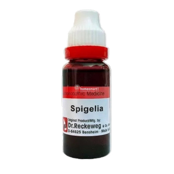 Bottle of Spigelia homeopathic medicine with a white cap and red label on a black background