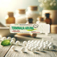 terminalia arjuna homeopathy pills inside a pharmacy with bottles 
